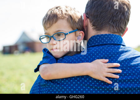 Father And Son Hugging On Outdoor summer Stock Photo