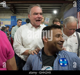 Democratic VP nominee Tim Kaine encourages volunteers at an Austin phone bank during a fund-raising swing through Texas. Stock Photo