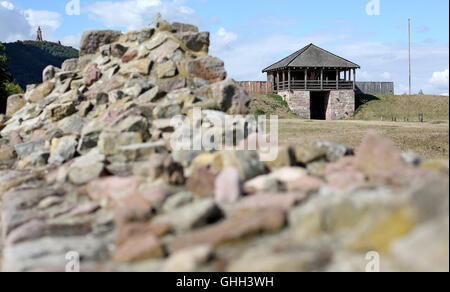 Tilleda, Germany. 29th Aug, 2016. The main castle's gate and wall of the royal palace in Tilleda, Germany, 29 August 2016. Recent excavations have uncovered that, throughout the Middle Ages, the former royal palace used to be twice as large than previously thought. Otto II (955-983), Holy Roman Emperor, presented the area that encompasses Tilleda Royal Palace to his wife, Byzantine princess Theophanu, as a wedding gift. Today, Tilleda is the largest archaeological outdoor museum in the German state of Saxony-Anhalt. Photo: Jan Woitas/dpa/Alamy Live News Stock Photo