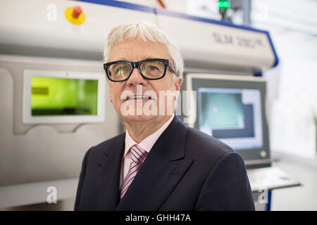 Duesseldorf, Germany. 14th Sep, 2016. Wolfgang Eder, chairman of the Austrian steel group Voestalpine, standing in front of a laser melting facility during the opening of a new research centre for 3D metal printing of the company in Duesseldorf, Germany, 14 September 2016. The group bundles its research in the area of 3D printing with the title 'voestalpine Additive Manufacturing Center GmbH'. PHOTO: WOLFRAM KASTL/dpa/Alamy Live News Stock Photo