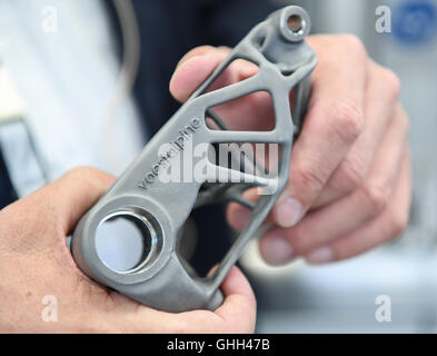 Duesseldorf, Germany. 14th Sep, 2016. The logo of Austrian steel group Voestalpine can be seen on a metal part during the opening of a new research centre for 3D metal printing of the company in Duesseldorf, Germany, 14 September 2016. The group bundles its research in the area of 3D printing with the title 'voestalpine Additive Manufacturing Center GmbH'. PHOTO: WOLFRAM KASTL/dpa/Alamy Live News Stock Photo