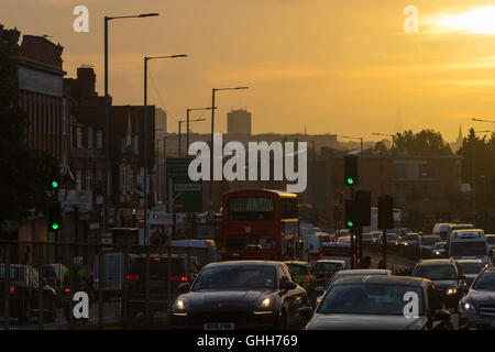 Acton, London, September 28th 2016. UK Weather: Traffic on the A40 rumbles into the capital with distant skyscrapers in the city appearing through the haze as a new day dawns in London. Credit:  Paul Davey/Alamy Live News Stock Photo