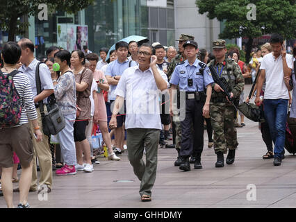 Los Angeles, California, USA. 4th Sep, 2016. Police officers patrol along the Nanjing Road Pedestrian Street on September 5, 2016, in Shanghai, China. Nanjing Road is the main shopping street of Shanghai, China, and is one of the world's busiest shopping streets. The street is named after the city of Nanjing, capital of Jiangsu province neighbouring Shanghai. Today's Nanjing Road comprises two sections, Nanjing Road East and Nanjing Road West. In some contexts, ''Nanjing Road'' refers only to what was pre-1945 Nanjing Road, today's Nanjing Road East, which is largely pedestrianised. Befo Stock Photo