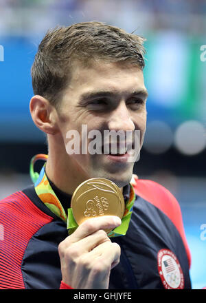 Gold medalist USA's Michael Phelps after the Men's 200m Butterfly Final at the Olympic Aquatics Stadium on the fourth day of the Rio Olympic Games, Brazil. Stock Photo