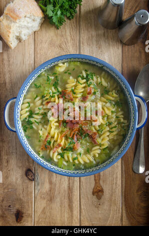Leek and pasta soup topped with bacon Stock Photo