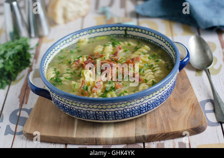 Leek and pasta soup topped with bacon Stock Photo