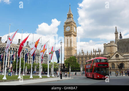 London Scene with red Double Decker Bus and the Big Ben Clock Tower and Westminster abbey Stock Photo