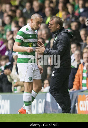 Celtic's Scott Brown shares a joke with manager Brendan Rodgers during the Betfred Cup match at Celtic Park, Glasgow. Stock Photo