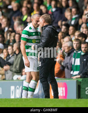 Celtic's Scott Brown shares a joke with manager Brendan Rodgers during the Betfred Cup match at Celtic Park, Glasgow. Stock Photo