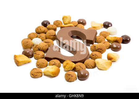 Traditional dutch Sinterklaas candy as pepernoten, kruidnoten and a chocolate letter S. Stock Photo