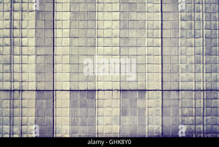 Vintage toned old ceramic tile wall, abstract background. Stock Photo