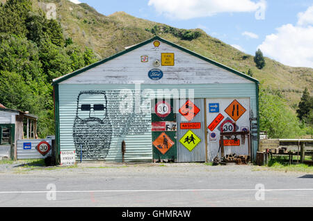 Road signs on shed, Whangamomona, Forgotten Highway, Taranaki, North Island, New Zealand Stock Photo