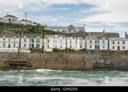 Houses lining the harbour at Porthleven, Cornwall Stock Photo