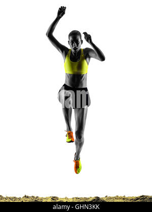 one woman praticing Long Jump silhouette in studio silhouette isolated on white background Stock Photo