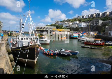 Fishing boats moored in Mevagissey harbour, Cornwall, England, UK Stock Photo