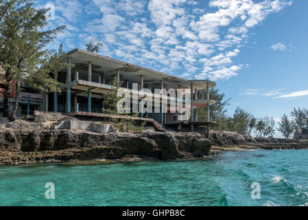 The derelict art deco hotel on Sanata Carolina Island in The Bazaruto Archipelago off Mozambique seen from the sea. Stock Photo