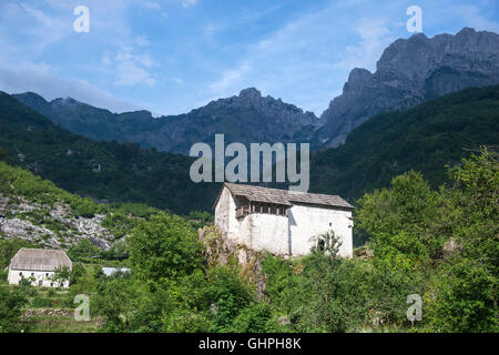 Traditional Ottoman period defensive house now the local Ethnographic Museum at Theth, with the Albanian Alps in the background, Stock Photo
