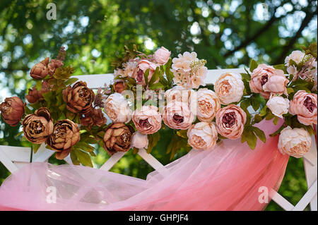 beautifully flowered wedding arch for the ceremony Stock Photo