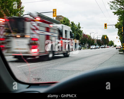 Fire engine speeding to an emergency, Vancouver, Canada. Stock Photo