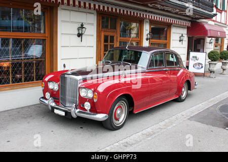 beautiful red car parked near the cafe Stock Photo