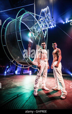 Circus of Horrors cast: Portrait of the acrobatic stunt performers, Vitalie Eremia and Svilen Marinov with their Wheel of Death. Stock Photo