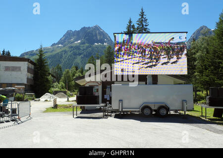 Stage 17, 2016 Le Tour de France on big screen, Vallorcine station square,(Aiguille de Mesure behind) Haute Savoie, France Stock Photo