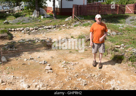 Archaeologist Bill Gilbert at work on the Plantation Site at Cupids in Newfoundland and Labrador, Canada. Stock Photo