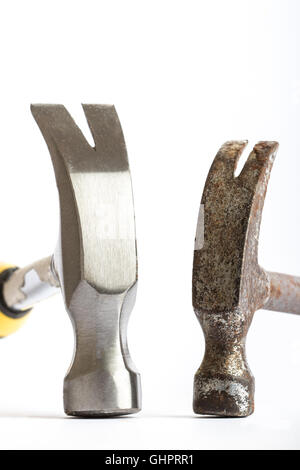 Two hammers, one old one new on a white background Stock Photo