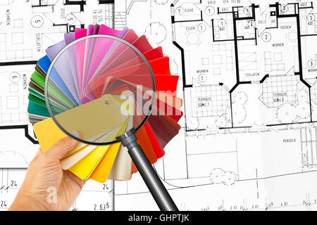 Rainbow color palette with magnifier and construction plan in background Stock Photo