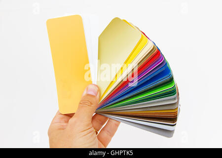 Man holding rainbow color palette isolated on white Stock Photo