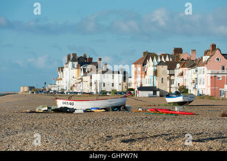 Commercial fishing boats, nets and equipment on the shingle beach at Aldeburgh Suffolk UK Stock Photo