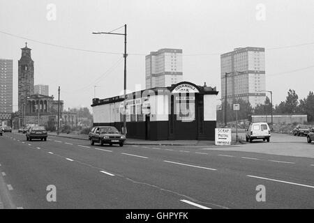 A view of Govanhill Bar, Thistle Street, Gorbals, Glasgow. 1991. Visible behind is Caledonia Road United Presbyterian Church and High Rise Flats. Stock Photo