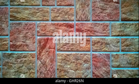 Wall, lined with colored square tiles in shades of pink. Stock Photo