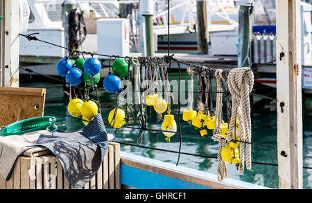 Colorful Floats on Railing in harbor Stock Photo