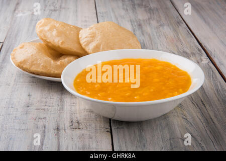 Aamras or Aam Ras Puri: Puri which is an indian fried small bread and alphonso mango pulp is a popular lunch in summer Stock Photo