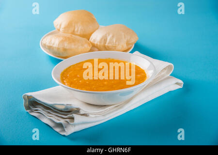 Aamras or Aam Ras Puri: Puri which is an indian fried small bread and alphonso mango pulp is a popular lunch in summer Stock Photo