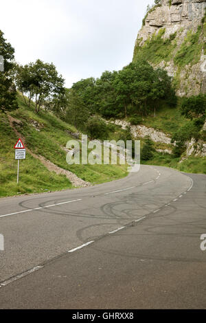 Skid marks left in the road by drivers of modified and custom cars in Cheddar Gorge where they meet  regularly August 2016 Stock Photo