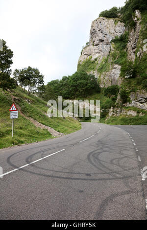 Skid marks left in the road by drivers of modified and custom cars in Cheddar Gorge where they meet  regularly August 2016 Stock Photo