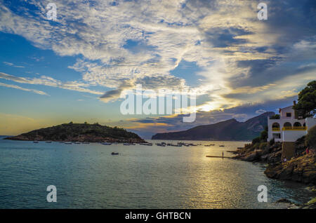 Beautiful sunset in Sant Elm at GR 221 in the Tramuntana mountains with island Sa Dragonera in the background, Mallorca, Spain Stock Photo