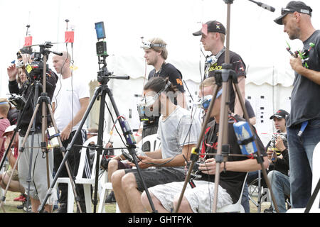Drone Racing Queen's Cup 2016. Drone racer pilots at the flightline prepare for flight prior to racing. Stock Photo
