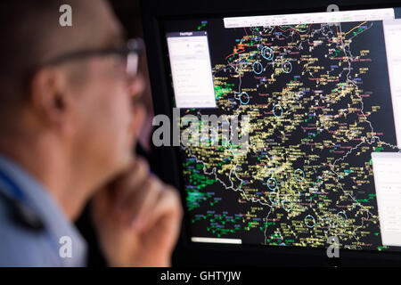 Uedem, Germany. 11th Aug, 2016. A German police officer sits at a monitor showing flight movements over Germany, at the Luftwaffe (German Air Force) operations centre in Uedem, Germany, 11 August 2016. At the operations centre, members of the German military, police force, air navigation services, and civil protection services work together as a national situation and command centre for airspace security. PHOTO: MARIUS BECKER/DPA/Alamy Live News Stock Photo