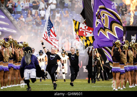 Baltimore, USA. 11th Aug, 2016. Flag bearers run onto the field ahead of the players before the first 2016 pre-season football game at M & T Bank Stadium, Baltimore, Maryland. Credit:  Amy Sanderson/ZUMA Wire/Alamy Live News Stock Photo
