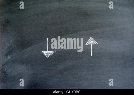 directional arrows written on a chalkboard Stock Photo