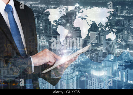 Business technology concept - Business man press digital tablet to show global network business partnership connection with fina Stock Photo