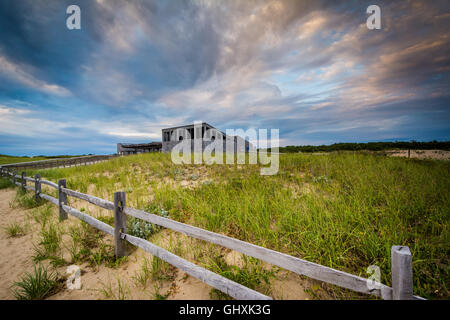 Dunes and building at sunset, at Herring Cove Beach, in the Province Lands at Cape Cod National Seashore, Massachusetts. Stock Photo