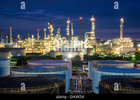 Oil refinery or petroleum refinery and storage tanks in night. Stock Photo