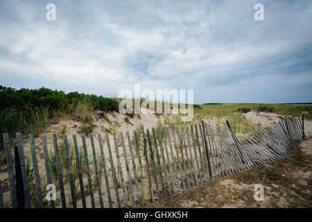 Fence and sand dunes at Town Beach, in Sandwich, Cape Cod, Massachusetts. Stock Photo