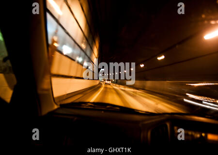 The blurred lights of traffic passing through a tunnel outside Kanazawa, Japan. Stock Photo