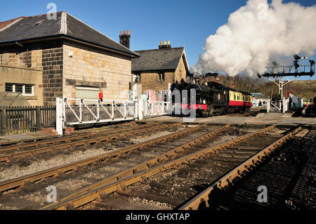 Ex-GWR 0-6-2 tank locomotive No 6619 in action at Grosmont level crossing. Stock Photo