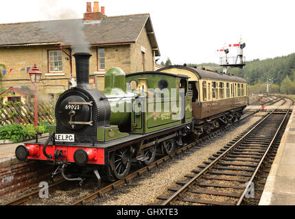 Class J72 0-6-0 tank locomotive No 69023 with observation coach, at Levisham station on the North Yorkshire Moors Railway. Stock Photo